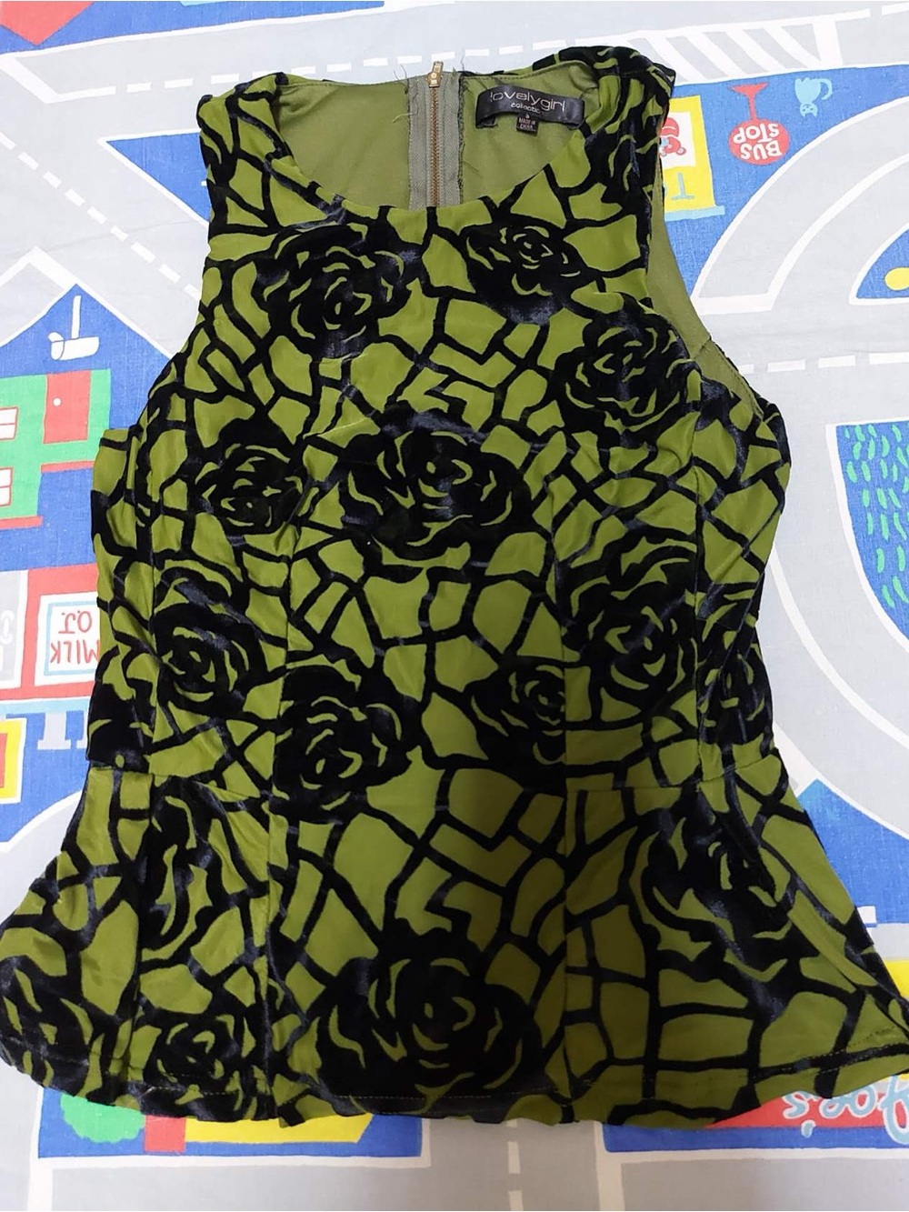 Green and black floral peplum top
